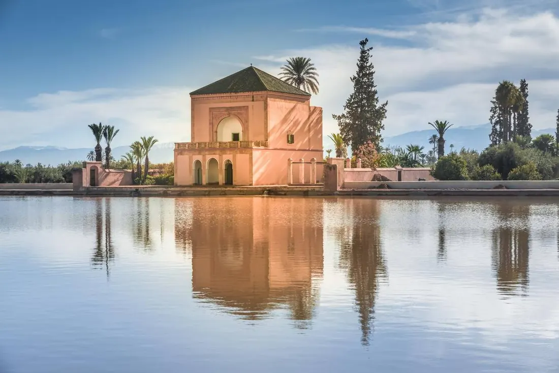 The Menara garden pavilion reflected in its basin