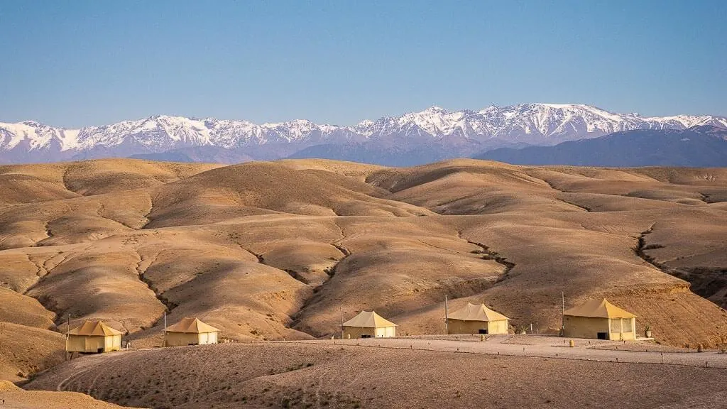 The Agafay desert with the snow-capped Atlas Mountains beyond