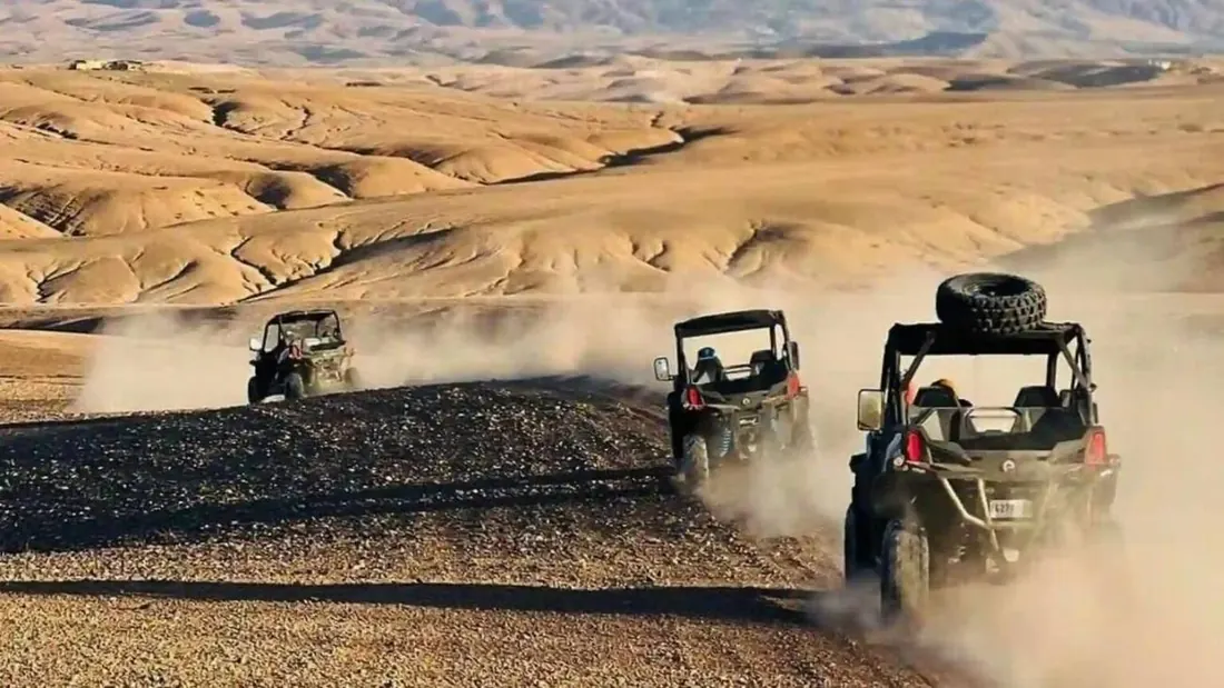 Buggies raising dust across the Agafay stone desert