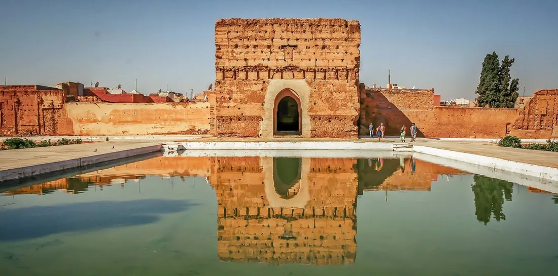 The El Badi palace ruins reflected in a pool