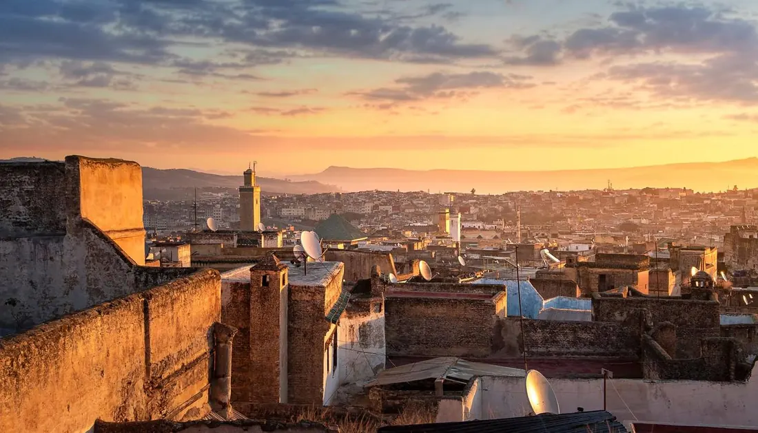 Rooftops of the Fes medina glowing at sunset